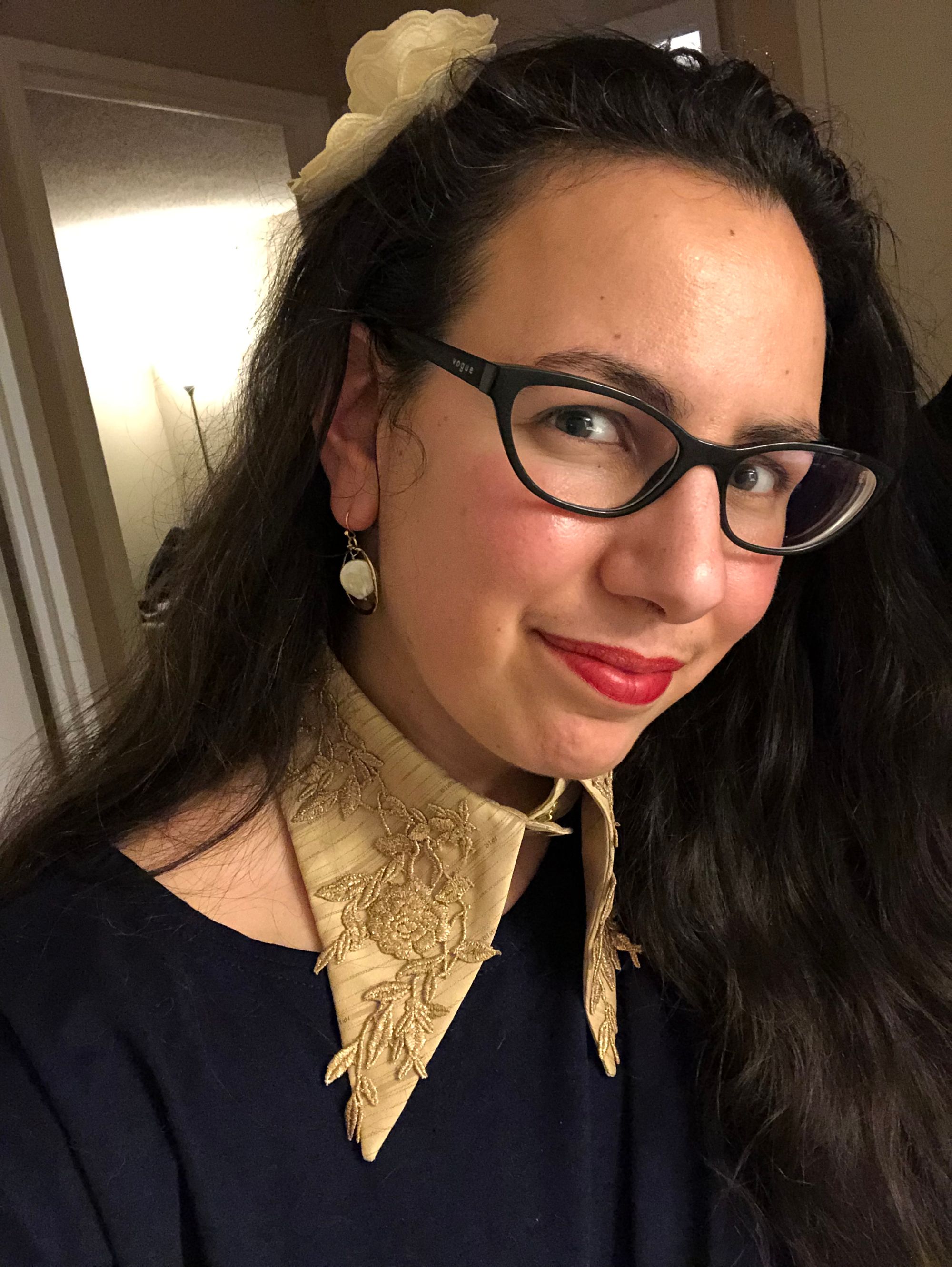 Selfie of me wearing with my long dark hair down. I'm wearing red lipstick, pearl earrings, and a Jasmine Chong detachable collar with lace flowers.