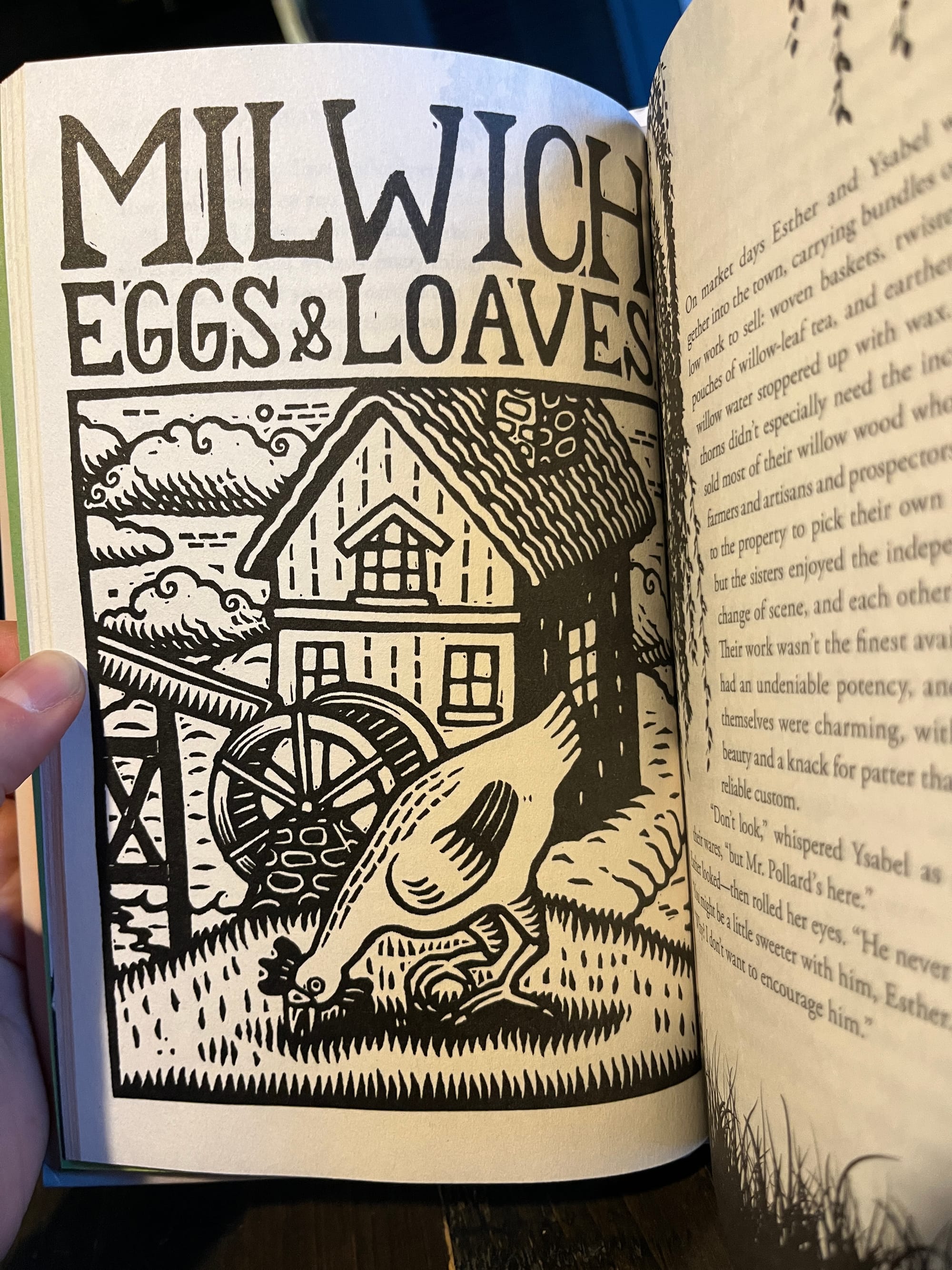 A woodcut-style illustration of  a chicken pecking grass in front of an old-fashioned mill, above which are the words MILWICH EGGS & LOAVES.