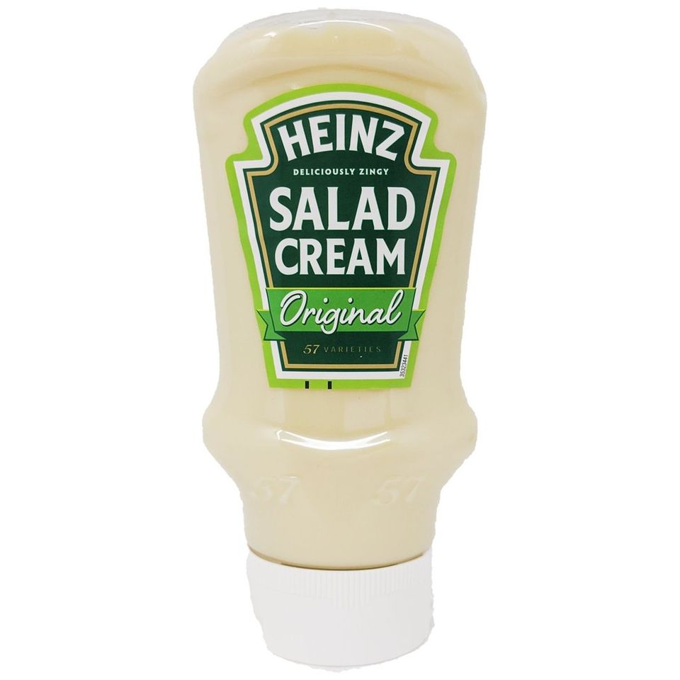 A free-standing squeeze-bottle of Heinz Salad Cream, its contents pale, with a green label calling it "deliciously zingy."